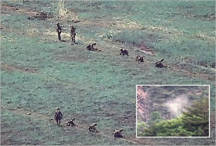 North Korean soldiers plant new land mines in the 