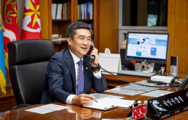Minister of National Defense Suh Wook holds phone 